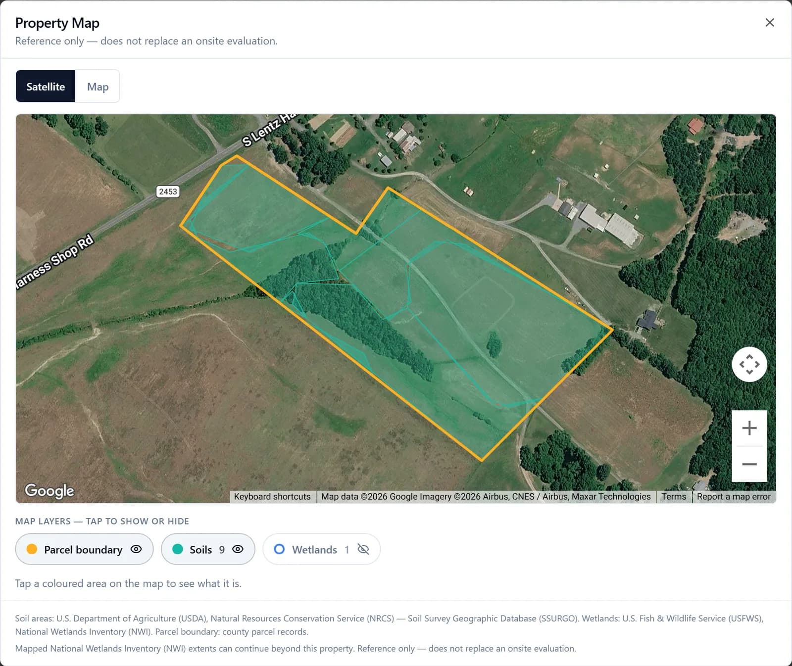 Property map with the county parcel boundary, USDA soil areas, and wetlands layers over satellite imagery
