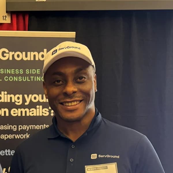 David Obim, founder and CEO of ServGround, at the ServGround conference booth